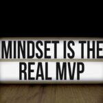 Motivational message 'Mindset is the Real MVP' displayed on a lightbox with black background.