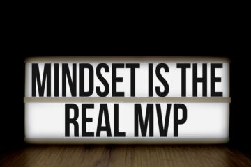 Motivational message 'Mindset is the Real MVP' displayed on a lightbox with black background.