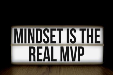 Motivational message 'Mindset is the Real MVP' displayed on a lightbox with black background.